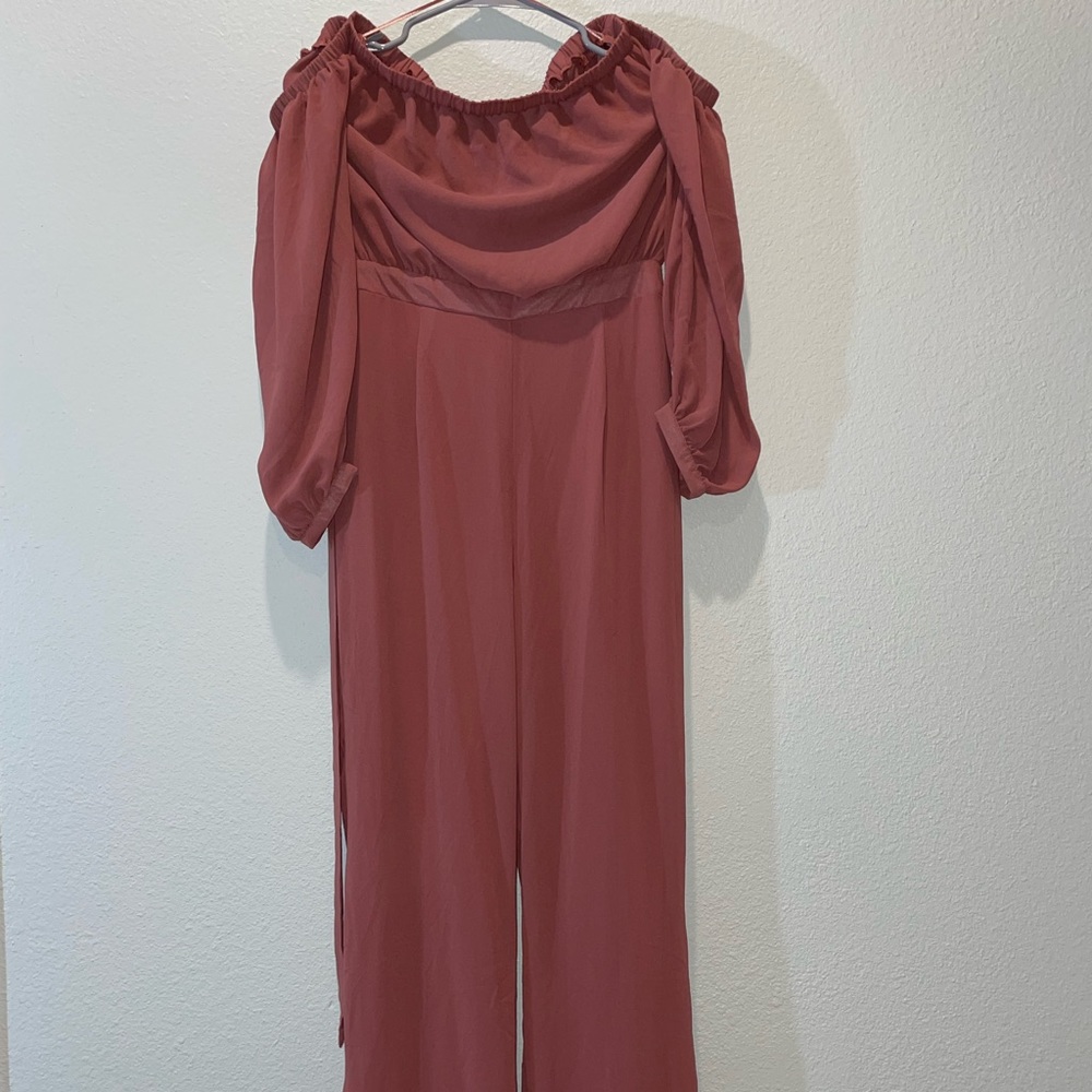 Revamped off the shoulder body suit. Size medium.